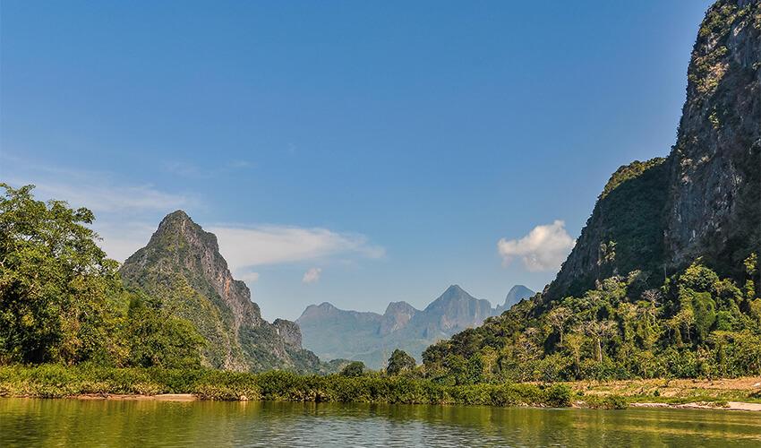 A river with mountains in the background.