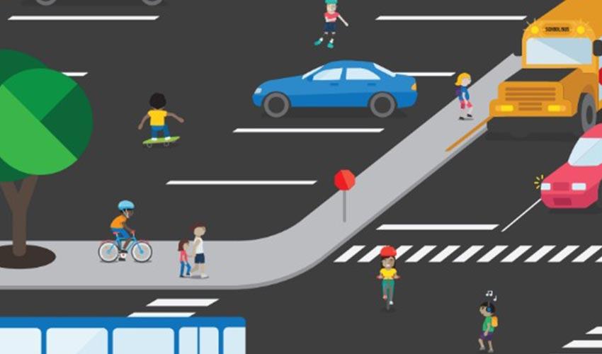 A group of people crossing the street with a bus and a school bus.