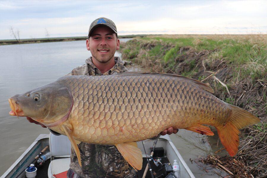 A man holding a large fish.